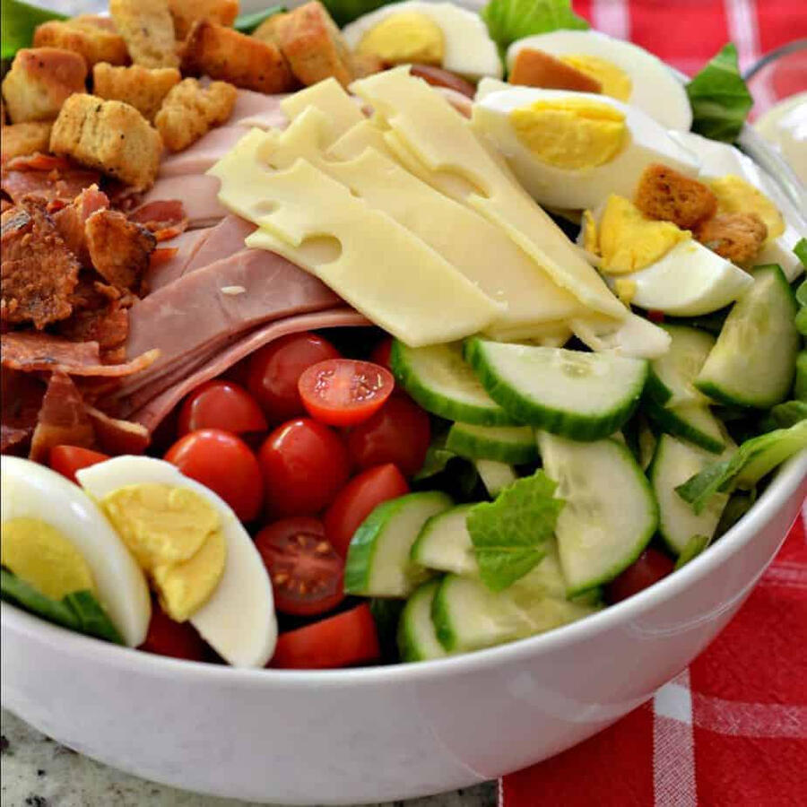 (Tues thru Friday) BIG SALAD OF THE WEEK: ($12.95) Chef Salad – on a bed of lettuce Swiss cheese, Virginia ham, honey roasted turkey, hard-boiled egg, shredded carrots, cucumbers, red onion, cherry tomatoes, croutons and homemade ranch dressing.